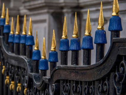 Close-up of an ornate iron fence with blue and gold spikes, Hoorn, Netherlands