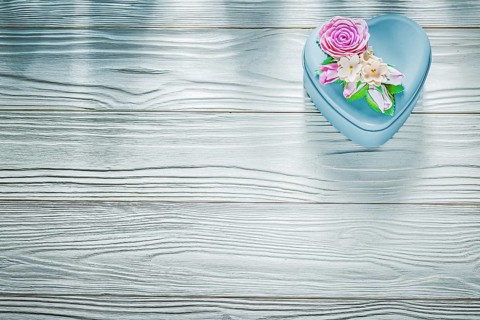 Metal present box on wooden board holidays concept