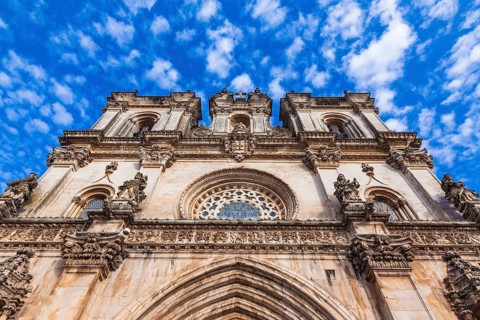 Portugal. Clock on the facade of the Catholic Cathedral of Alcobaça