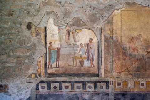 POMPEII, ITALY, MAY 04, 2022, Scenic painting of Roman inhabitants in a fresco of an ancient Roman