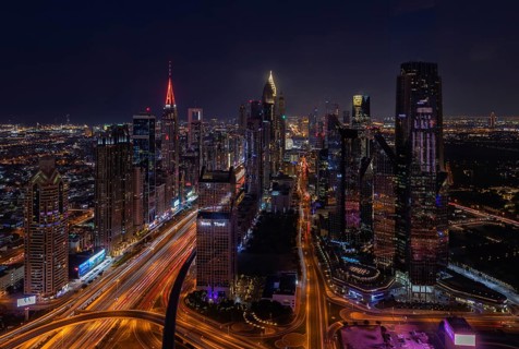 A picture of the tall buildings at the Trade Centre district at night