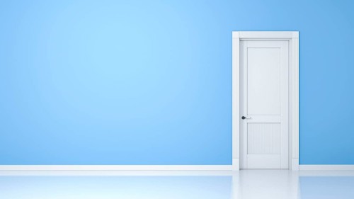 A wall and a door in an empty flat with space for your content