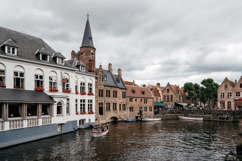 Bruges, Belgium, July 29, 2016: Canal scene in the city of Bruges. The historic city centre is a