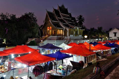 Night market in front of the Buddhist temple Haw Phra Bang of the Royal Palace, National Museum on