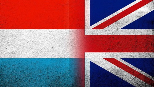 National flag of United Kingdom (Great Britain) Union Jack with Luxembourg National flag. Grunge