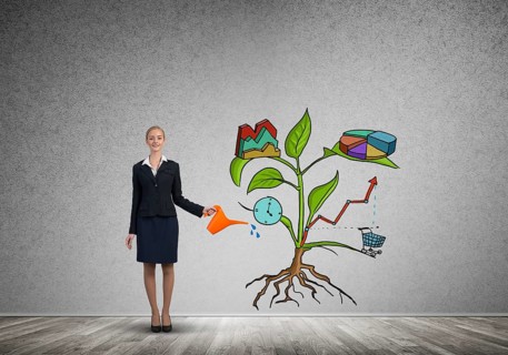 Attractive businesswoman presenting investment and financial growth concept