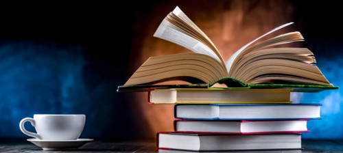 A composition with books and a cup of coffee