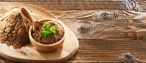Composition with a bowl of ground coriander