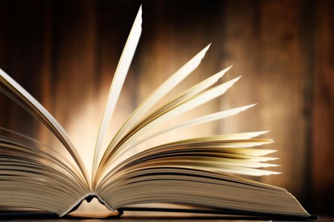 Composition with hardcover book on the table