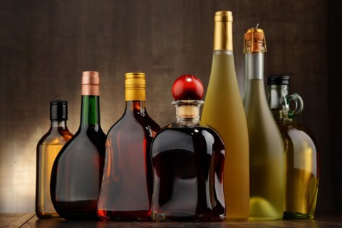 Composition with bottles of assorted alcoholic beverages