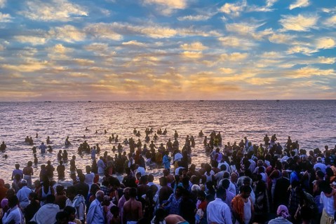 Devotees taking a dip in the holy waters of the Agni Theertham in Rameswaram, Tamil Nadu, South