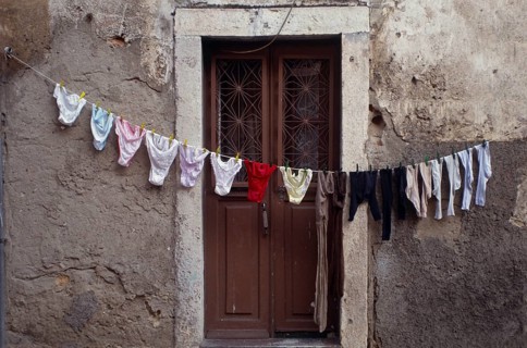Clothesline in front of front door in Alfama, the old town of Lisbon, Portugal