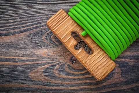 Garden tie wire on wooden board gardening concept