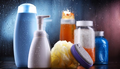 Different containers of body care products in the bathroom