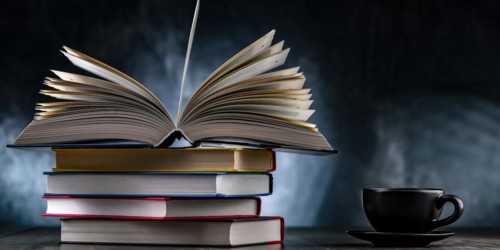 A composition with books and a cup of coffee