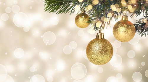 Christmas balls hanging on snowy fir tree. New years card