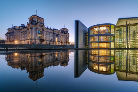 The famous Reichstag and Paul Löbe House on the Spree in Berlin after sunset