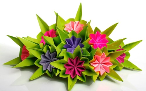 Origami bunch of various pink and violet flowers isolated on white
