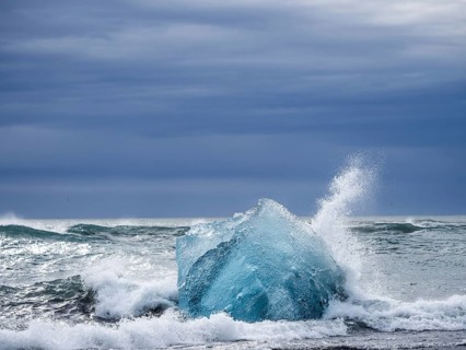 Diamond Beach, iceberg in the surf, near Jökulsarlon glacier lagoon, Vatnajökull National Park,