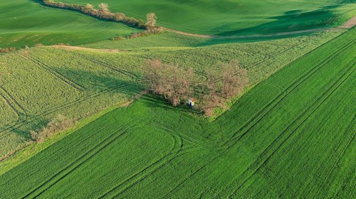 Aerial view of Chapel st. Barbara on South Moravian hill fields during spring time, Moravia, Czech