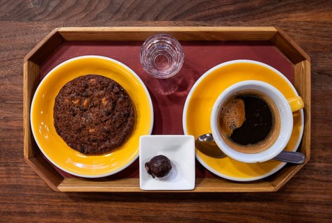 Plate with American style chocolate cookie, a coffee and a luxury chocolate, Brussels, Belgium