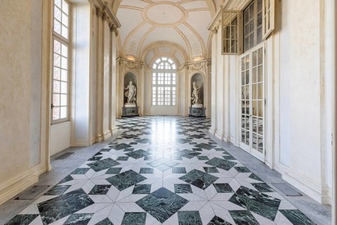 Venaria Reale, Italy, January 2023: luxury interior old royal palace. Gallery perspective with