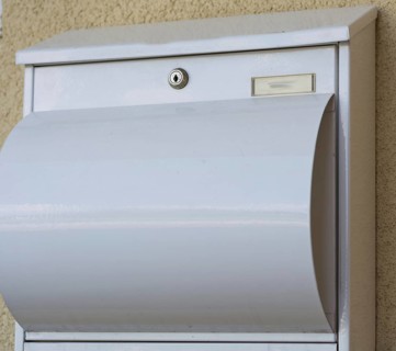 Modern white metal post box, Austria