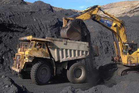 WESTPORT, NEW ZEALAND, CIRCA 2007: Digger loads up a truck with high grade coal at Stockton Coal