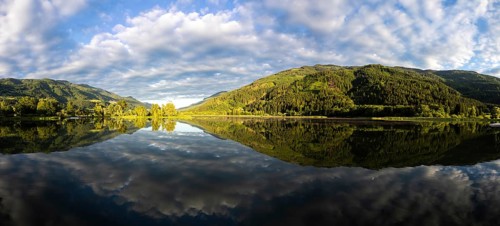 Clouds are reflected in the lake, Gaishorner See in the evening light, panoramic picture, Gaishorn