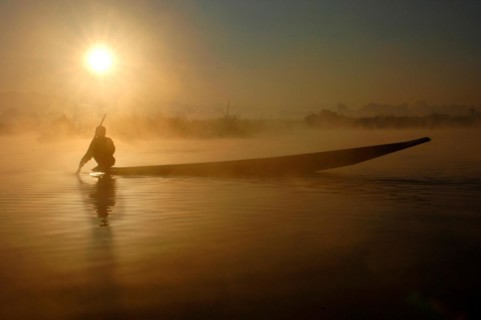 Myanmar, Fisherman with boat at Inle Lake, Myanmar