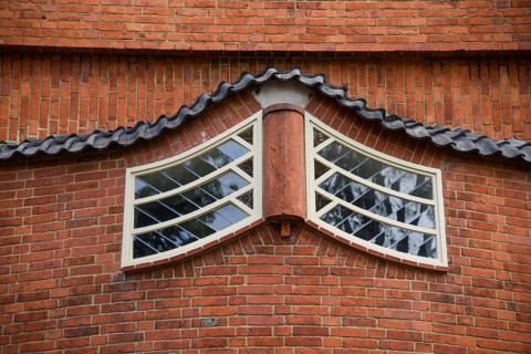 Amsterdam, Netherlands. June 2022. View of the facades of the characteristic brick building of