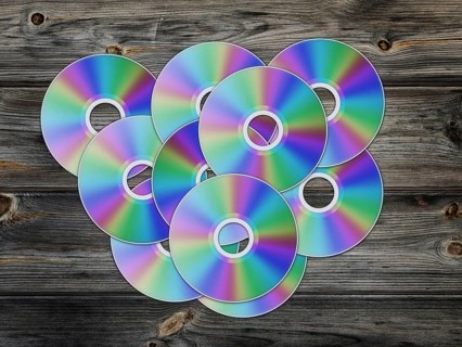 Cd disks over the wooden background