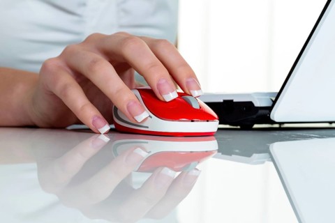 Woman in office with computer mouse. Correct working posture Austria