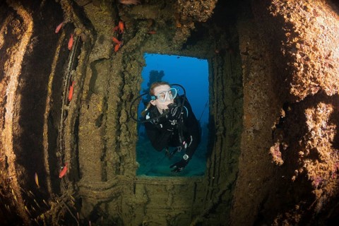 Divers at the stern of the Maldive Victory wreck, Hulhule, North Male Atoll, Maldives