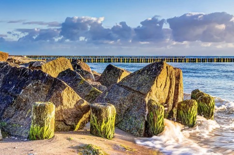 Wooden and rocky groynes on the coastline of the Baltic Sea, Germany