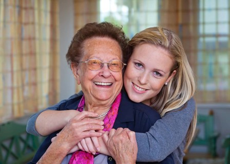 A grandson visits his grandmother Fun and joy during the hug. Austria