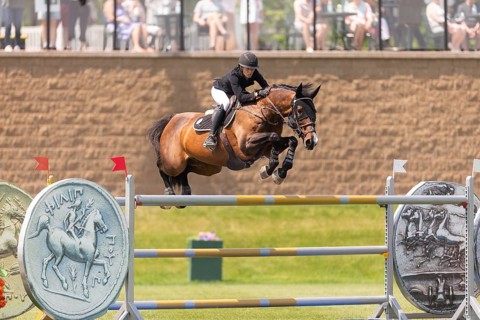 Katie Laurie of Australia and riding Django II, compete in the 1.60m Grand Prix during The