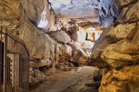 A stalactite cave with a path in the middle