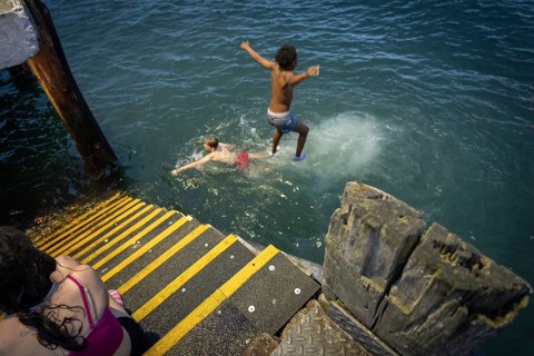 Children jumping into the sea, Cobh, Harbor of Cork, County Cork, Ireland, United Kingdom