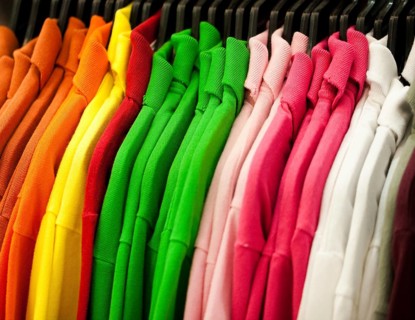 Colorful t-shirts hanging on a rack