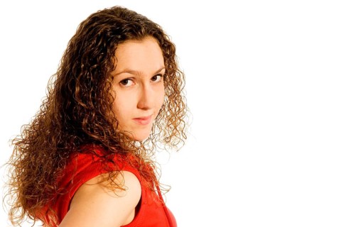 Portrait of a shy girl in red
