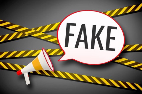 3D illustration of a megaphone and a speech bubble with the message fake