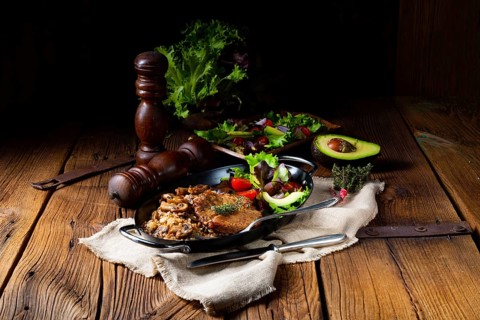 Pork steak with mushrooms and buckwheat groats and mango salad