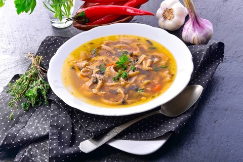 Traditional Politur-style tripe soup with beef and vegetables