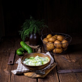 Fresh cucumber salad with yoghurt and young potatoes