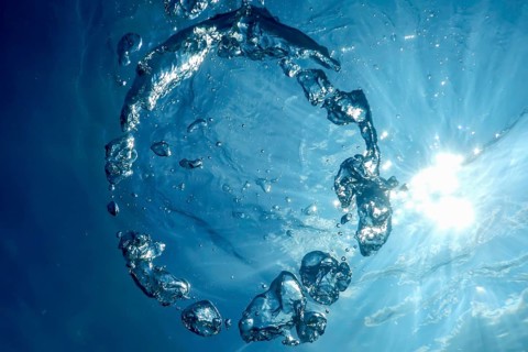 Underwater Bubble Ring Ascends towards the Sun