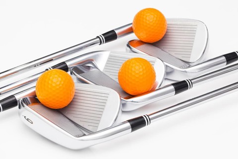 Titanium golf clubs on the white background