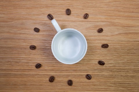 Coffee Time - Empty coffee cup and clock of coffee beans