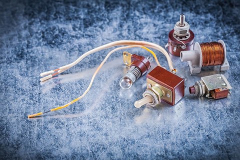 Group of electric devices on metallic background vintage electricity concept