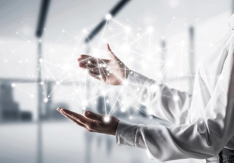 Business woman in shirt keeping white social media network structure in hands with office view on